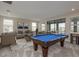 Entertainment room with a pool table and comfortable seating area at 6109 Marsh Trail Dr, Odessa, FL 33556