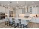 Bright kitchen featuring quartz countertops, stainless appliances, and pendant lighting at 6109 Marsh Trail Dr, Odessa, FL 33556