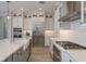 Well-lit kitchen with stainless steel appliances, white countertops, and pendant lighting at 6109 Marsh Trail Dr, Odessa, FL 33556
