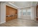 Living room with wood-look tile flooring, decorative built-in cabinets, and recessed lighting at 6109 Marsh Trail Dr, Odessa, FL 33556