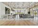 Spacious lounge with comfortable seating, natural light, and an inviting atmosphere for relaxation and socializing at 6109 Marsh Trail Dr, Odessa, FL 33556
