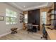Office space featuring two desks, ample lighting, and minimalist wall decorations at 6109 Marsh Trail Dr, Odessa, FL 33556