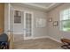 An office featuring a whiteboard, natural lighting, and sleek, modern design elements at 6109 Marsh Trail Dr, Odessa, FL 33556