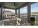 Covered patio offers a relaxing seating area and scenic view of the water at 6109 Marsh Trail Dr, Odessa, FL 33556
