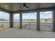 Covered patio offers panoramic views of the lake and surrounding neighborhood, perfect for outdoor entertaining at 6109 Marsh Trail Dr, Odessa, FL 33556