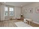Bright playroom featuring hardwood floors, ample natural light, and cozy furniture for to play at 6109 Marsh Trail Dr, Odessa, FL 33556