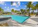 Bright community pool with ample lounge chairs and a clear blue sky on a sunny day at 6109 Marsh Trail Dr, Odessa, FL 33556