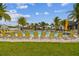 Inviting community pool lined with yellow lounge chairs and surrounded by lush green grass at 6109 Marsh Trail Dr, Odessa, FL 33556