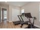 Light, airy workout room includes modern exercise equipment and natural light from the large window at 6109 Marsh Trail Dr, Odessa, FL 33556