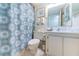 Cozy bathroom featuring decorative shower curtain, vanity, and nautical-themed accents at 6145 Sun Blvd # 404, St Petersburg, FL 33715