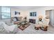An inviting living room with comfortable seating, stylish decor, and bright natural light from the windows at 6145 Sun Blvd # 404, St Petersburg, FL 33715