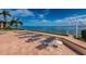 Enjoy waterfront views on the pool deck with chaise lounges and direct beach access at 6145 Sun Blvd # 404, St Petersburg, FL 33715