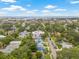 A high-angle view of the neighborhood with glimpses of the ocean in the distance under a blue sky at 661 14Th S Ave, St Petersburg, FL 33701