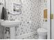 Charming powder room features unique dog-themed wallpaper and elegant fixtures at 661 14Th S Ave, St Petersburg, FL 33701