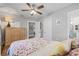 View of bedroom with floral bedding, closet, and doorway leading to other rooms at 661 14Th S Ave, St Petersburg, FL 33701