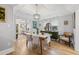 Bright dining room features stylish chandelier, hardwood floors, and decor accents throughout at 661 14Th S Ave, St Petersburg, FL 33701