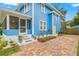 Exterior view of a charming home with a well-manicured lawn, beautiful landscaping, and a brick driveway at 661 14Th S Ave, St Petersburg, FL 33701