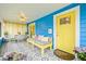 Inviting front porch with bright yellow door and comfortable seating with stylish tile flooring at 661 14Th S Ave, St Petersburg, FL 33701