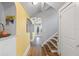 Inviting hallway with hardwood floors and neutral paint, leading to kitchen and stairs at 661 14Th S Ave, St Petersburg, FL 33701