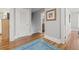 Hallway view features hardwood floors, gray paint and white trim, and doorways to other rooms at 661 14Th S Ave, St Petersburg, FL 33701