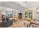 Bright and airy living room with hardwood floors, stylish decor, and a view of the pool at 661 14Th S Ave, St Petersburg, FL 33701