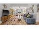 Bright living room with stylish decor, hardwood floors, and view to front porch at 661 14Th S Ave, St Petersburg, FL 33701