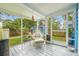 Screened patio featuring comfortable seating, string lights, and views of the backyard at 661 14Th S Ave, St Petersburg, FL 33701
