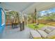 Covered patio featuring a dining area, comfortable seating, and a view of the backyard at 661 14Th S Ave, St Petersburg, FL 33701