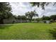 Large, well-maintained yard offers plenty of space and utility sheds at 7240 Ottley St, Zephyrhills, FL 33541
