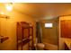 Bathroom features a combination tub and shower, toilet, and vanity at 7240 Ottley St, Zephyrhills, FL 33541