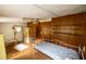 Bedroom features wood floors, wood paneling and built in shelves at 7240 Ottley St, Zephyrhills, FL 33541