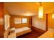 This cozy bedroom features wood floors and a spacious built-in closet at 7240 Ottley St, Zephyrhills, FL 33541