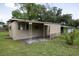 Exterior view of a home featuring a covered patio area at 7240 Ottley St, Zephyrhills, FL 33541