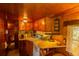 Kitchen with ample counter space, vintage appliances, and wood accents at 7240 Ottley St, Zephyrhills, FL 33541