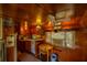 Charming retro kitchen with wood paneled walls, vintage appliances, and cozy dining area at 7240 Ottley St, Zephyrhills, FL 33541