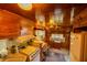 Galley kitchen with retro appliances, wood accents, and compact design at 7240 Ottley St, Zephyrhills, FL 33541