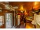 Spacious retro kitchen featuring classic appliances and a wood paneled interior at 7240 Ottley St, Zephyrhills, FL 33541
