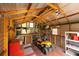 Versatile shed interior, complete with workbench, shelves, and ample space for tools and equipment at 7240 Ottley St, Zephyrhills, FL 33541