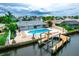Gorgeous aerial view of a home on the water with a large pool and private boat dock at 913 Spindle Palm Way, Apollo Beach, FL 33572