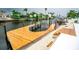 Picturesque waterfront view featuring a private dock with boat lift access to the serene canal at 913 Spindle Palm Way, Apollo Beach, FL 33572