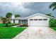 Well-maintained single-Gathering home with an attached garage and freshly cut lawn at 913 Spindle Palm Way, Apollo Beach, FL 33572