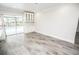 Bright living room with sliding doors that lead to the pool and canal at 913 Spindle Palm Way, Apollo Beach, FL 33572