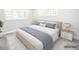 Bright main bedroom with neutral tones, plantation shutters, and minimalist décor at 913 Spindle Palm Way, Apollo Beach, FL 33572