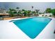 Beautiful pool with sparkling water, surrounded by a spacious deck and serene waterfront views at 913 Spindle Palm Way, Apollo Beach, FL 33572