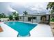 Beautiful backyard pool area with lush landscaping, ideal for relaxing and enjoying the outdoors at 913 Spindle Palm Way, Apollo Beach, FL 33572