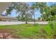 Spacious backyard featuring a full privacy fence and mature trees at 963 27Th S Ave, St Petersburg, FL 33705