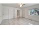 Bright bedroom with tile flooring and natural light from window at 963 27Th S Ave, St Petersburg, FL 33705