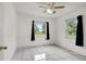 Bright bedroom with tile flooring, ceiling fan and two windows at 963 27Th S Ave, St Petersburg, FL 33705