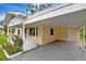 Spacious carport adjacent to a single-story home, offering convenient covered parking at 963 27Th S Ave, St Petersburg, FL 33705