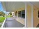 Covered front porch with a well-kept exterior, offering a relaxing outdoor space at 963 27Th S Ave, St Petersburg, FL 33705